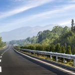 open stretch of highway with trees on both sides